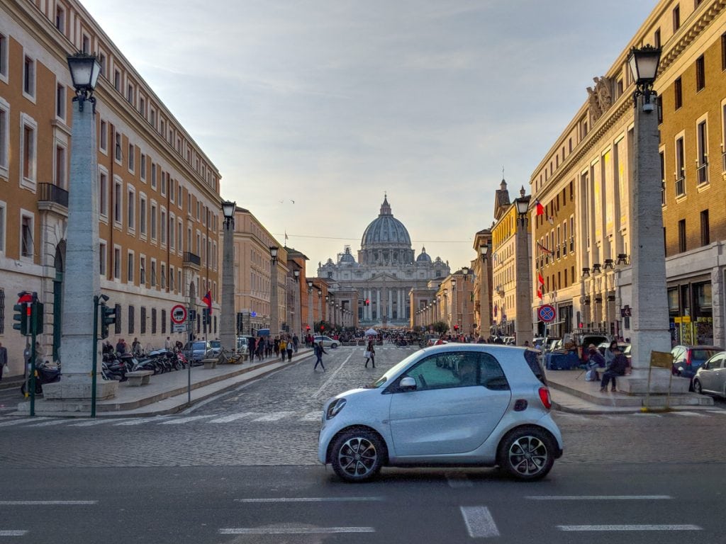 A car passes the Piazza Pia in front of St. Peter’s Basilica