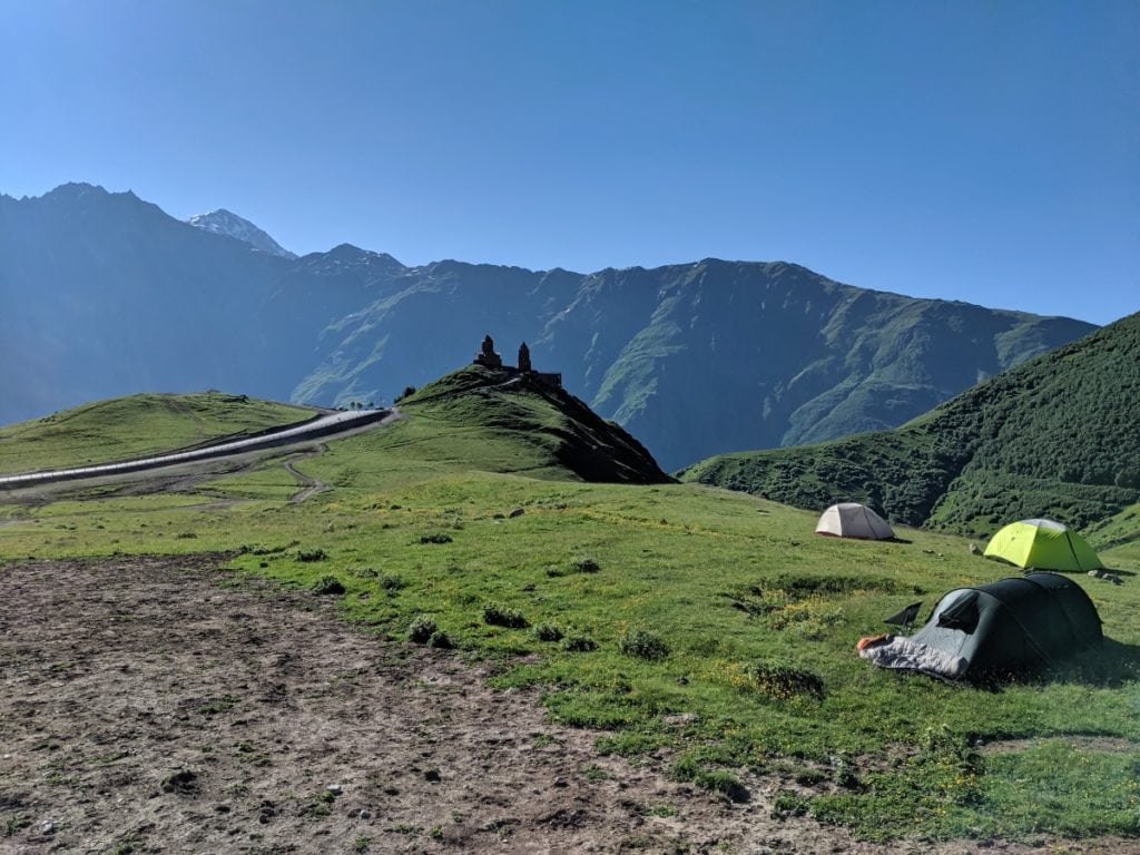 hikers camping near gergeti church stepantsminda