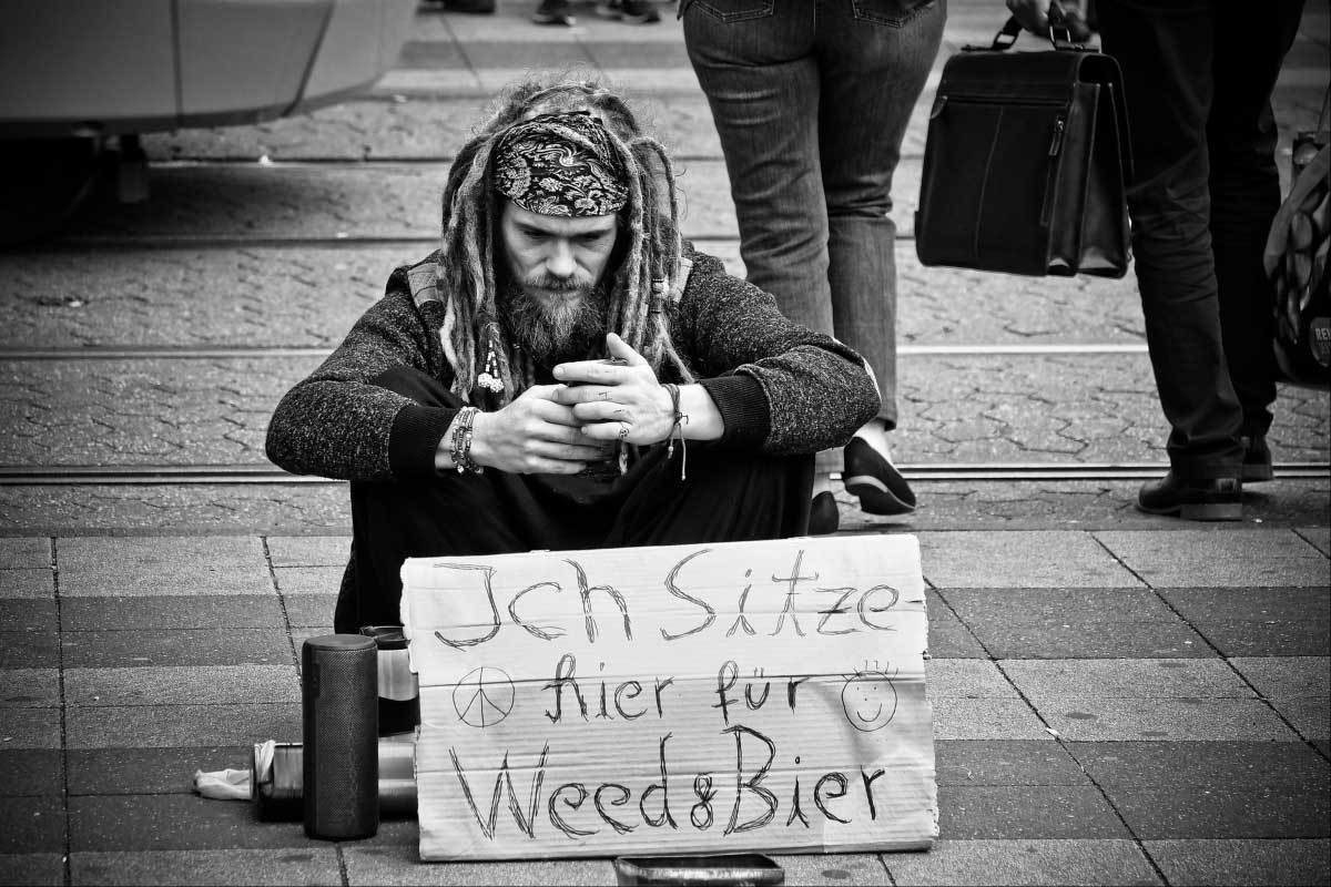 Western Begpacker On The Street