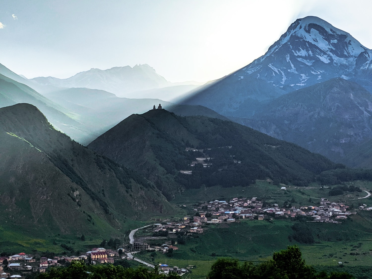 Image of The Gergeti Trinity Church in the shadow of Mount Kazbek