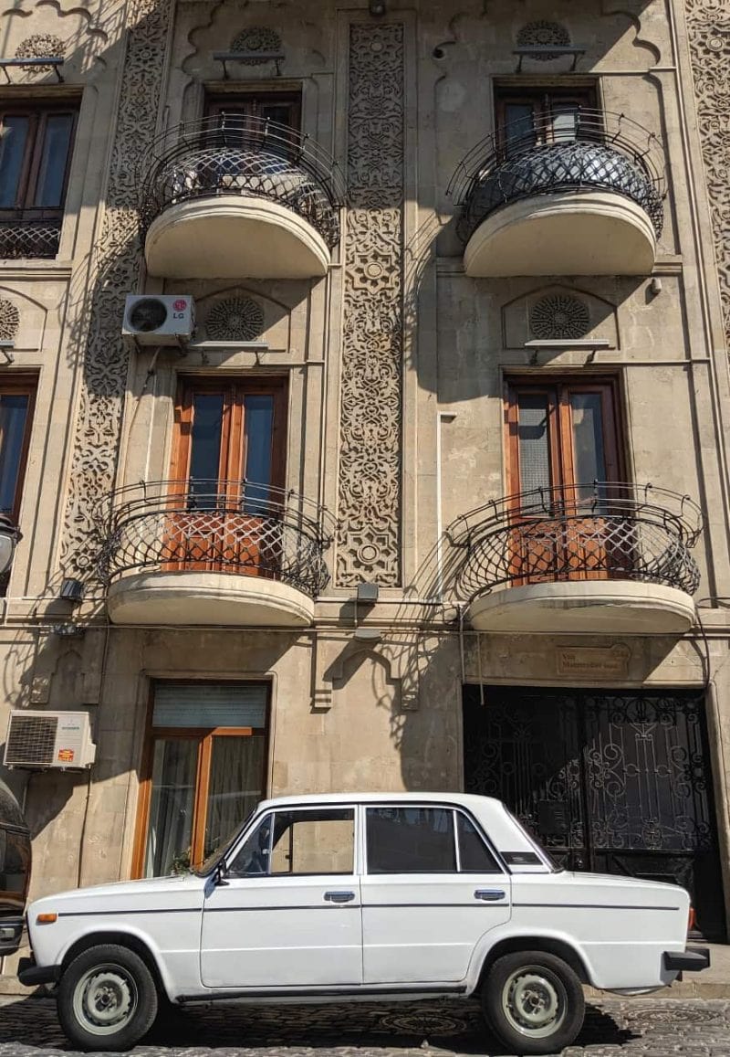 Od town buildings and a Lada