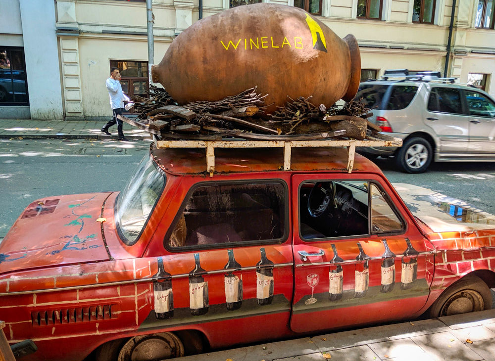 Winelab car with qvevri on the streets of tbilisi