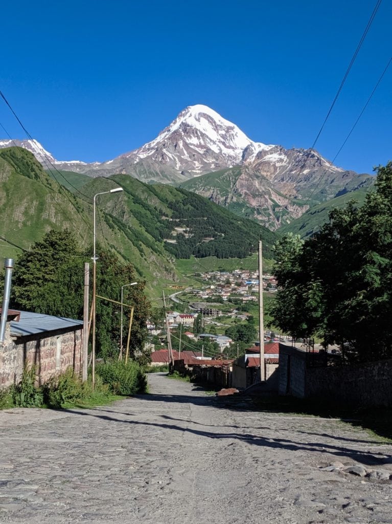 stepantsminda village street with mountain view