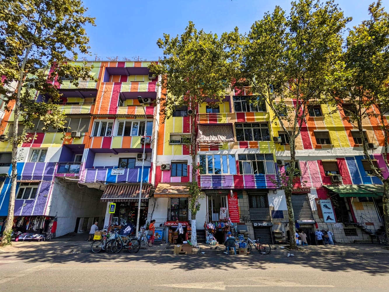 colorful residential buildings near river in tirana